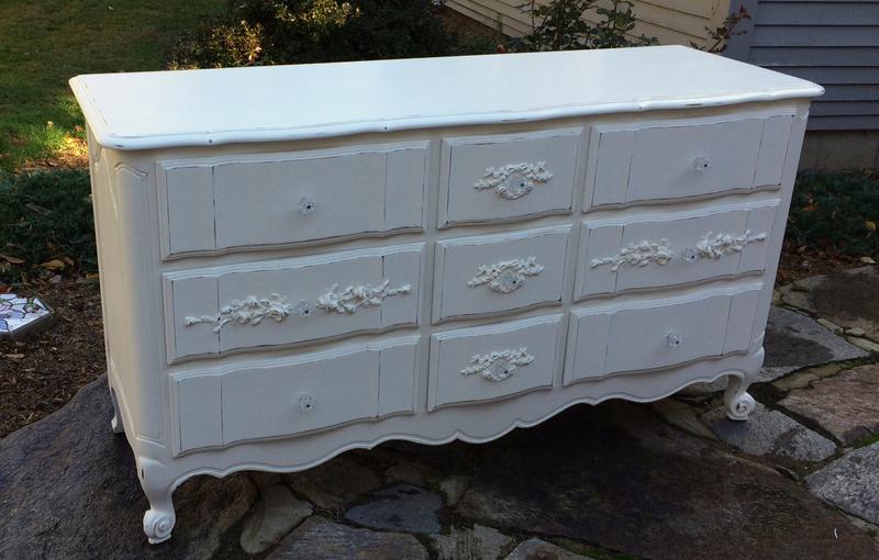 Nine drawer dresser painted white with roses